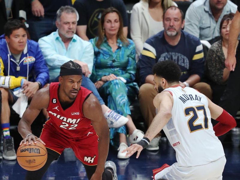 DENVER, CO - JUNE 12: Jimmy Butler #22 of the Miami Heat dribbles the ball during game 5 of the 2023 NBA Finals against the Denver Nuggets on June 12, 2023 at the Ball Arena in Denver, Colorado. NOTE TO USER: User expressly acknowledges and agrees that, by downloading and/or using this Photograph, user is consenting to the terms and conditions of the Getty Images License Agreement. Mandatory Copyright Notice: Copyright 2023 NBAE (Photo by Issac Baldizon/NBAE via Getty Images)