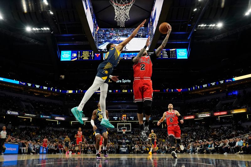 INDIANAPOLIS, INDIANA - JANUARY 08: Lonzo Ball #2 of the Chicago Bulls shoots against Tyrese Haliburton #0 of the Indiana Pacers during an NBA basketball game at Gainbridge Fieldhouse on January 08, 2025 in Indianapolis, Indiana. NOTE TO USER: User expressly acknowledges and agrees that, by downloading and or using this Photograph, user is consenting to the terms and conditions of the Getty Images License Agreement. (Photo by Jeff Dean/Getty Images)