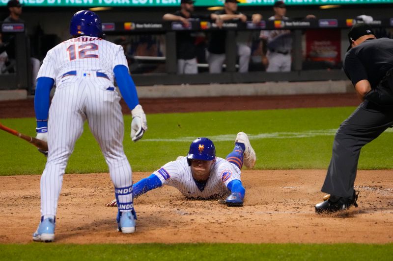 Jul 2, 2023; New York City, New York, USA; New York Mets center fielder Brandon Nimmo (9) scores a run on New York Mets left fielder Tommy Pham (28) RBI double against the San Francisco Giants during the fourth inning at Citi Field. Mandatory Credit: Gregory Fisher-USA TODAY Sports