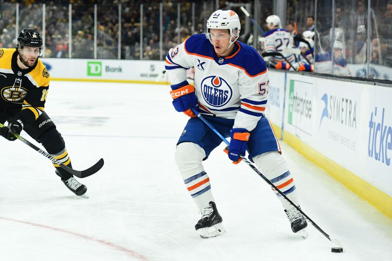 Jan 7, 2025; Boston, Massachusetts, USA;  Edmonton Oilers center Jeff Skinner (53) controls the puck while Boston Bruins center Pavel Zacha (18) defends during the second period at TD Garden. Mandatory Credit: Bob DeChiara-Imagn Images