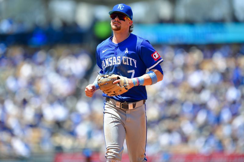 Jun 16, 2024; Los Angeles, California, USA; Kansas City Royals shortstop Bobby Witt Jr. (7) returns to the dugout following the fourth inning against the Los Angeles Dodgers at Dodger Stadium. Mandatory Credit: Gary A. Vasquez-USA TODAY Sports