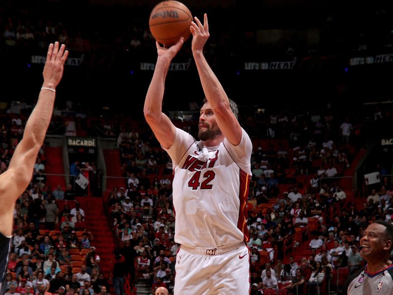 MIAMI, FL - APRIL 1: Kevin Love #42 of the Miami Heat shoots the ball during the game against the Dallas Mavericks on April 1, 2023 at Miami-Dade Arena in Miami, Florida. NOTE TO USER: User expressly acknowledges and agrees that, by downloading and or using this Photograph, user is consenting to the terms and conditions of the Getty Images License Agreement. Mandatory Copyright Notice: Copyright 2023 NBAE (Photo by Issac Baldizon/NBAE via Getty Images)