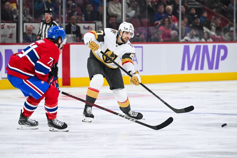 Nov 23, 2024; Montreal, Quebec, CAN; Las Vegas Golden Knights defenseman Shea Theodore (27) plays the puck against Montreal Canadiens center Jake Evans (71) during the third period at Bell Centre. Mandatory Credit: David Kirouac-Imagn Images