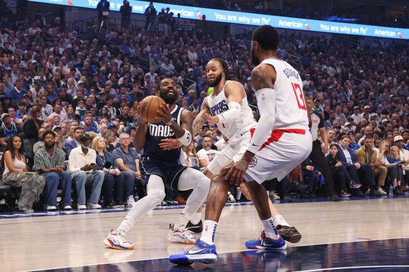 DALLAS, TX - APRIL 28: Kyrie Irving #11 of the Dallas Mavericks handles the ball during the game against the LA Clippers during Round 1 Game 4 of the 2024 NBA Playoffs on April 28, 2024 at the American Airlines Center in Dallas, Texas. NOTE TO USER: User expressly acknowledges and agrees that, by downloading and or using this photograph, User is consenting to the terms and conditions of the Getty Images License Agreement. Mandatory Copyright Notice: Copyright 2024 NBAE (Photo by Tim Heitman/NBAE via Getty Images)