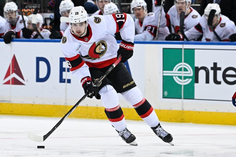 Jan 21, 2025; New York, New York, USA;  Ottawa Senators right wing Drake Batherson (19) skates with the puck against the New York Rangers during the third period at Madison Square Garden. Mandatory Credit: Dennis Schneidler-Imagn Images