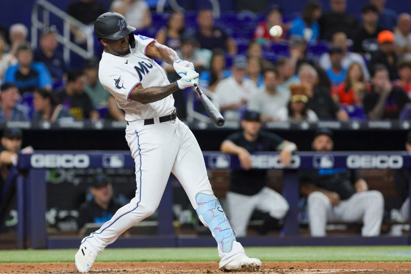 Aug 15, 2023; Miami, Florida, USA; Miami Marlins designated hitter Jorge Soler (12) hits a two-run home run against the Houston Astros during the third inning at loanDepot Park. Mandatory Credit: Sam Navarro-USA TODAY Sports