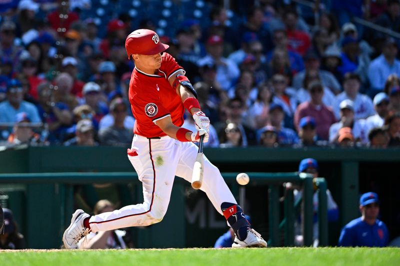 Apr 27, 2025; Washington, District of Columbia, USA; Washington Nationals outfielder Alex Call hits a RBI single against the New York Mets during the seventh inning at Nationals Park. Mandatory Credit: Brad Mills-Imagn Images