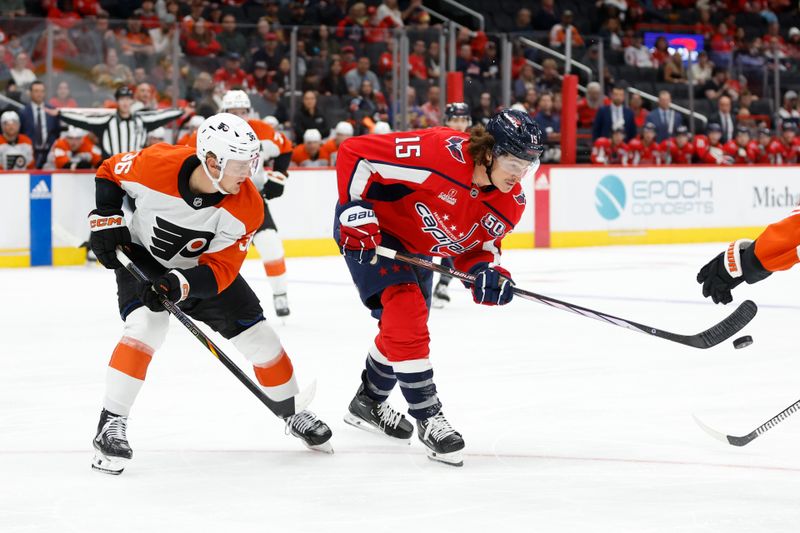 Sep 22, 2024; Washington, District of Columbia, USA; Washington Capitals forward Sonny Milano (15) and Philadelphia Flyers forward Emil Andrae (36) battle for the puck in the third period at Capital One Arena. Mandatory Credit: Geoff Burke-Imagn Images