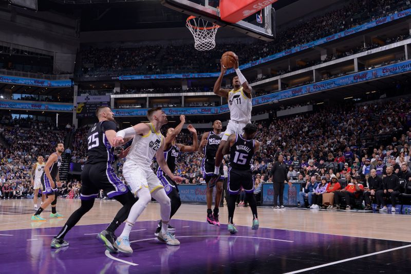 SACRAMENTO, CA - MARCH 31: Kris Dunn #11 of the Utah Jazz drives to the basket during the game against the Sacramento Kings on March 31, 2024 at Golden 1 Center in Sacramento, California. NOTE TO USER: User expressly acknowledges and agrees that, by downloading and or using this Photograph, user is consenting to the terms and conditions of the Getty Images License Agreement. Mandatory Copyright Notice: Copyright 2024 NBAE (Photo by Rocky Widner/NBAE via Getty Images)