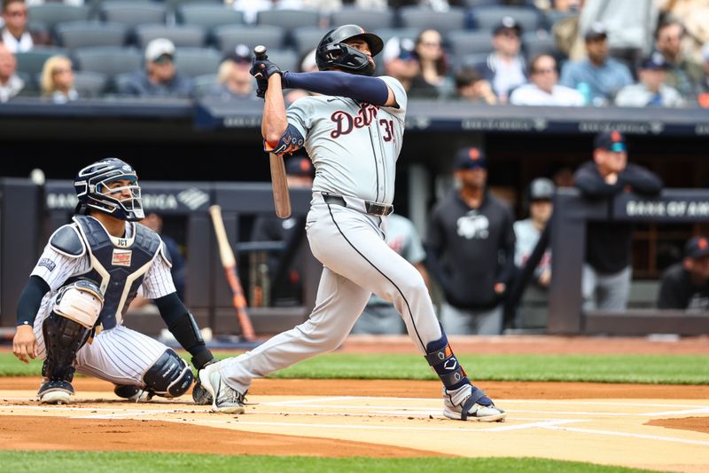 May 4, 2024; Bronx, New York, USA;  Detroit Tigers left fielder Riley Greene (31) hits a solo home run in the first inning against the New York Yankees at Yankee Stadium. Mandatory Credit: Wendell Cruz-USA TODAY Sports