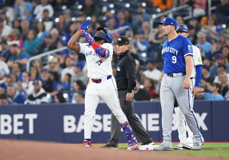 May 1, 2024; Toronto, Ontario, CAN; Toronto Blue Jays first base Vladimir Guerrero Jr. (27) celebrates hitting a single against the Kansas City Royals during the first inning at Rogers Centre. Mandatory Credit: Nick Turchiaro-USA TODAY Sports
