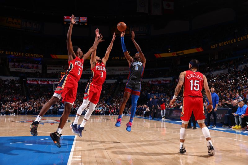 OKLAHOMA CITY, OK - DECEMBER 23: Shai Gilgeous-Alexander #2 of the Oklahoma City Thunder shoots the ball over two New Orleans Pelicans defenders during the game on December 23, 2022 at Paycom Arena in Oklahoma City, Oklahoma. NOTE TO USER: User expressly acknowledges and agrees that, by downloading and or using this photograph, User is consenting to the terms and conditions of the Getty Images License Agreement. Mandatory Copyright Notice: Copyright 2022 NBAE (Photo by Zach Beeker/NBAE via Getty Images)