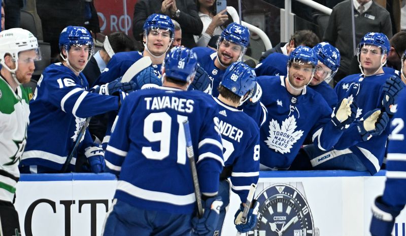 Feb 7, 2024; Toronto, Ontario, CAN; Toronto Maple Leafs forward William Nylander (88) is greeted by team mates at the bench after scoring against the Dallas Stars in the third period at Scotiabank Arena. Mandatory Credit: Dan Hamilton-USA TODAY Sports