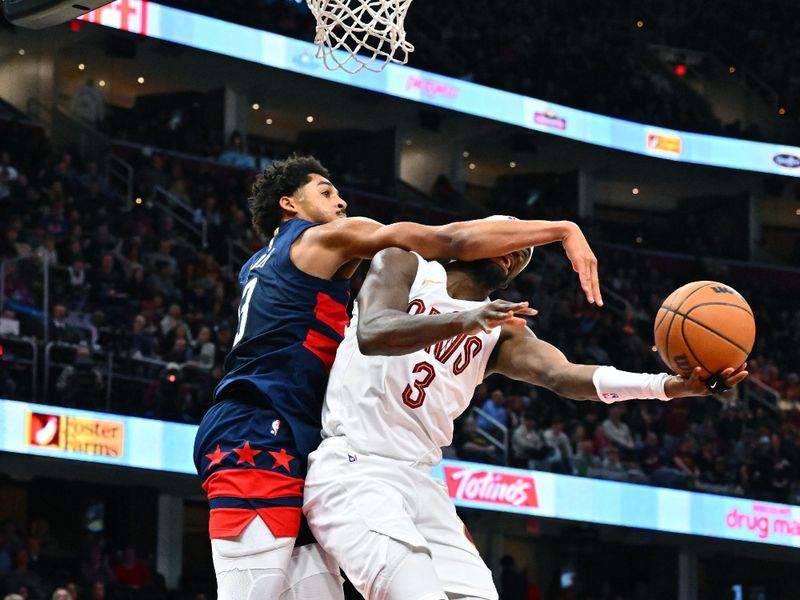 CLEVELAND, OHIO - DECEMBER 13: Jordan Poole #13 of the Washington Wizards fouls Caris LeVert #3 of the Cleveland Cavaliers during the third quarter at Rocket Mortgage Fieldhouse on December 13, 2024 in Cleveland, Ohio. The Cavaliers defeated the Wizards 115-105. NOTE TO USER: User expressly acknowledges and agrees that, by downloading and or using this photograph, User is consenting to the terms and conditions of the Getty Images License Agreement. (Photo by Jason Miller/Getty Images)