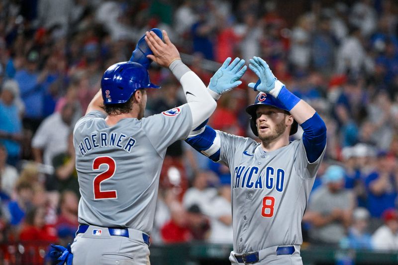 May 26, 2024; St. Louis, Missouri, USA;  Chicago Cubs left fielder Ian Happ (8) celebrates with second baseman Nico Hoerner (2) after hitting a two run home run during the seventh inning at Busch Stadium. Mandatory Credit: Jeff Curry-USA TODAY Sports