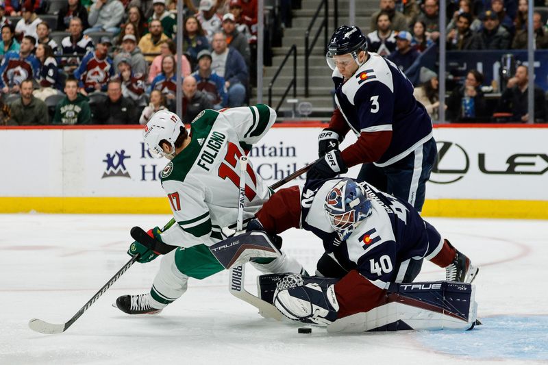 Mar 8, 2024; Denver, Colorado, USA; Colorado Avalanche goaltender Alexandar Georgiev (40) covers up the puck against Minnesota Wild left wing Marcus Foligno (17) as defenseman Jack Johnson (3) defends in the first period at Ball Arena. Mandatory Credit: Isaiah J. Downing-USA TODAY Sports