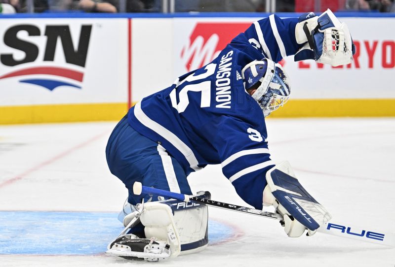 Mar 23, 2024; Toronto, Ontario, CAN; Toronto Maple Leafs goalie Ilya Samsonov (35) makes a glove save against the Edmonton Oilers in the second period at Scotiabank Arena. Mandatory Credit: Dan Hamilton-USA TODAY Sports