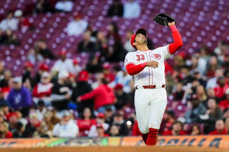 Apr 22, 2024; Cincinnati, Ohio, USA; Cincinnati Reds first baseman Christian Encarnacion-Strand (33) catches a pop up hit by Philadelphia Phillies outfielder Johan Rojas (not pictured) in the seventh inning at Great American Ball Park. Mandatory Credit: Katie Stratman-USA TODAY Sports