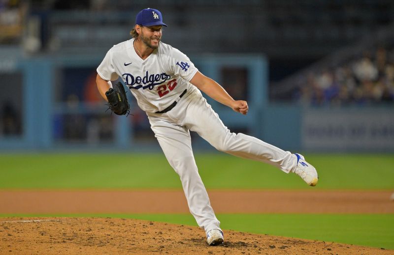 Aug 16, 2023; Los Angeles, California, USA;  Los Angeles Dodgers starting pitcher Clayton Kershaw (22) throws to the plate in the fourth inning against the Milwaukee Brewers at Dodger Stadium. Mandatory Credit: Jayne Kamin-Oncea-USA TODAY Sports