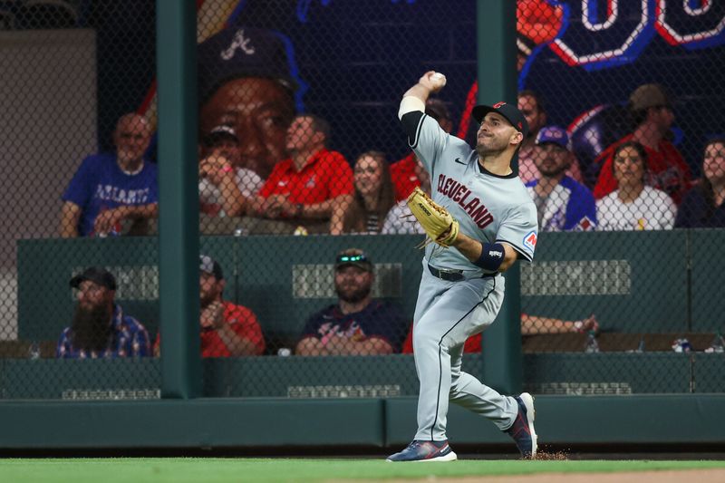 Apr 26, 2024; Atlanta, Georgia, USA; Cleveland Guardians right fielder Ramon Laureano (10) throws the ball against the Atlanta Braves in the fifth inning at Truist Park. Mandatory Credit: Brett Davis-USA TODAY Sports