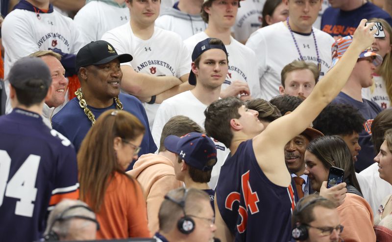 Feb 14, 2024; Auburn, Alabama, USA; Former Auburn Tigers football player Bo Jackson poses for selfies during the first half against the South Carolina Gamecocks at Neville Arena. Mandatory Credit: John Reed-USA TODAY Sports