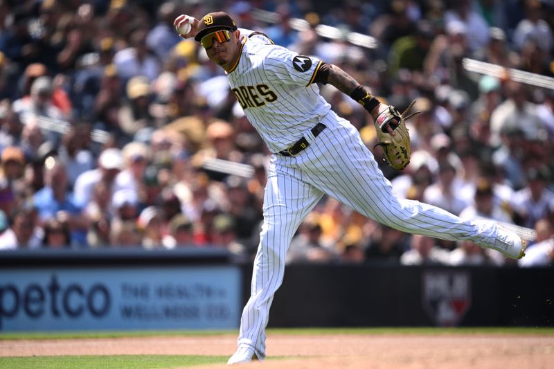 Apr 19, 2023; San Diego, California, USA; San Diego Padres third baseman Manny Machado (13) throws to first base on a ground out by Atlanta Braves shortstop Vaughn Grissom (18) during the seventh inning at Petco Park. Mandatory Credit: Orlando Ramirez-USA TODAY Sports