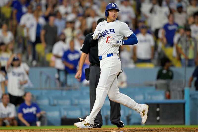 Sep 6, 2024; Los Angeles, California, USA;  Los Angeles Dodgers designated hitter Shohei Ohtani (17) jogs home as he watches a bases loaded double play to end the eighth inning against the Cleveland Guardians at Dodger Stadium. Mandatory Credit: Jayne Kamin-Oncea-Imagn Images