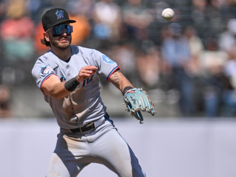 Jun 26, 2025; San Francisco, California, USA; Miami Marlins third baseman Connor Norby (1) throws to first base for an out against the San Francisco Giants in the ninth inning at Oracle Park. Mandatory Credit: Eakin Howard-Imagn Images