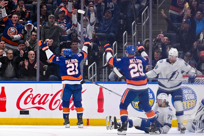 Feb 8, 2024; Elmont, New York, USA; New York Islanders center Kyle Palmieri (21) celebrates his goal against the Tampa Bay Lightning during the first period at UBS Arena. Mandatory Credit: Dennis Schneidler-USA TODAY Sports