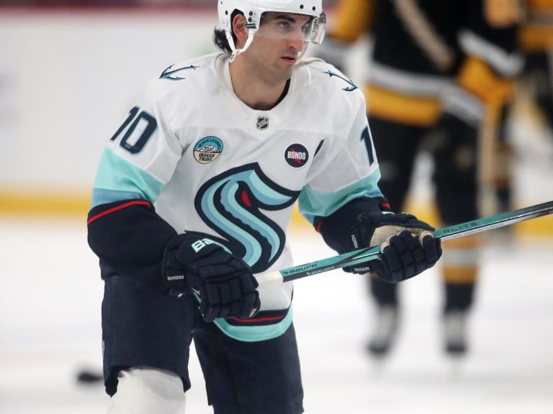 Jan 14, 2025; Pittsburgh, Pennsylvania, USA;  Seattle Kraken center Matty Beniers (10) warms up before a game against the Pittsburgh Penguins at PPG Paints Arena. Mandatory Credit: Charles LeClaire-Imagn Images