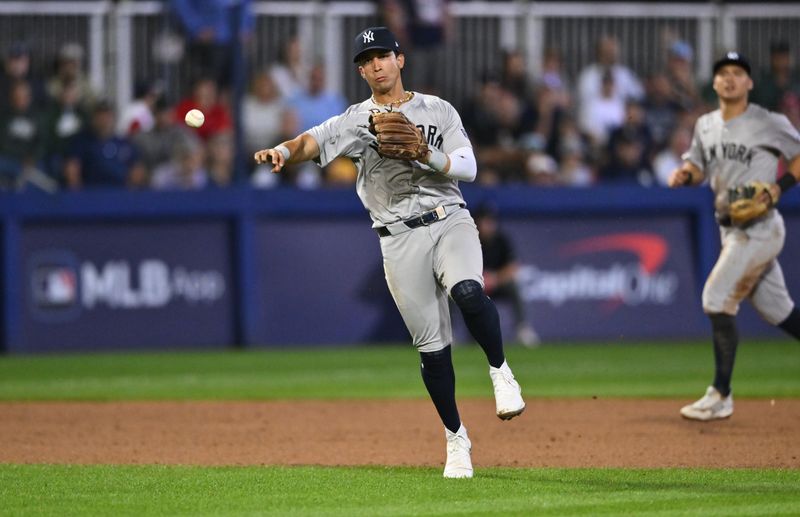 Aug 18, 2024; Williamsport, Pennsylvania, USA; New York Yankees infielder Oswaldo Cabrera (95) throws to first against the Detroit Tigers in the eighth inning at BB&T Ballpark at Historic Bowman Field. Mandatory Credit: Kyle Ross-USA TODAY Sports