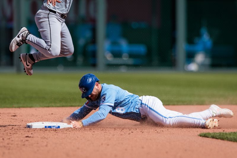 Apr 7, 2024; Kansas City, Missouri, USA; Kansas City Royals outfielder Kyle Isbel (28) dives into 2nd base during the eighth inning against the Chicago White Sox at Kauffman Stadium. Mandatory Credit: William Purnell-USA TODAY Sports