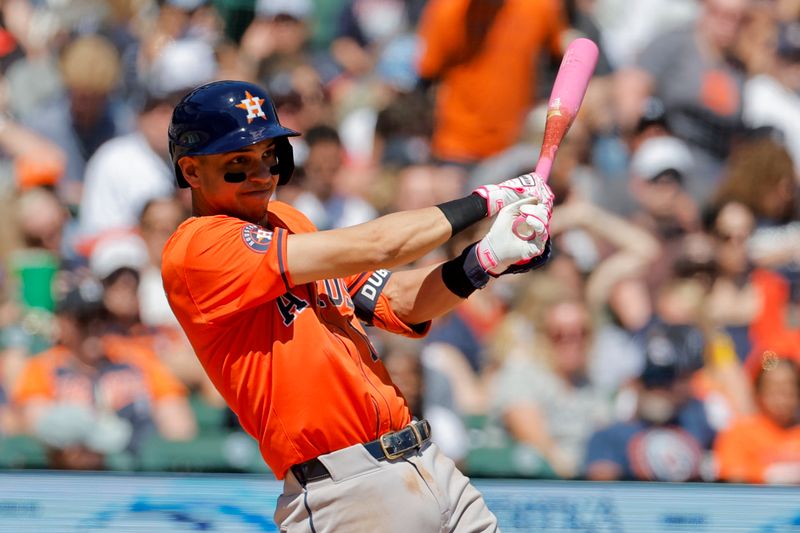 May 12, 2024; Detroit, Michigan, USA;  Houston Astros second baseman Mauricio Dubon (14) hits an RBI single in the seventh inning against the Detroit Tigers at Comerica Park. Mandatory Credit: Rick Osentoski-USA TODAY Sports