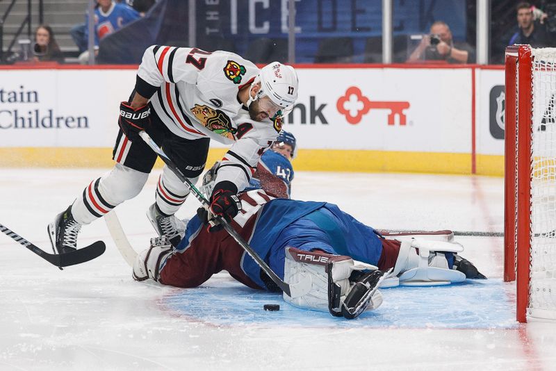 Oct 19, 2023; Denver, Colorado, USA; Colorado Avalanche goaltender Alexandar Georgiev (40) makes a save against Chicago Blackhawks left wing Nick Foligno (17) in the first period at Ball Arena. Mandatory Credit: Isaiah J. Downing-USA TODAY Sports