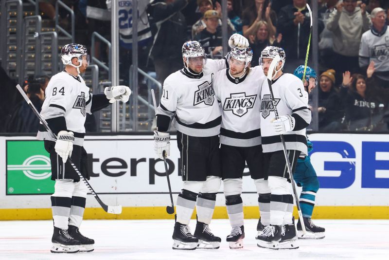 Dec 27, 2023; Los Angeles, California, USA; Los Angeles Kings right wing Adrian Kempe (9) celebrates with his teammates after scoring a goal against the San Jose Sharks during the third period of a game at Crypto.com Arena. Mandatory Credit: Jessica Alcheh-USA TODAY Sports