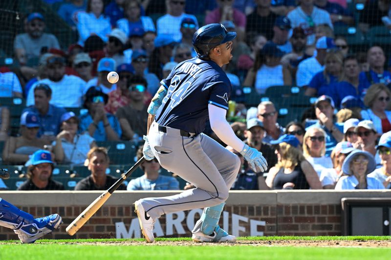 Sep 14, 2025; Chicago, Illinois, USA;  Tampa Bay Rays outfielder Christopher Morel (24) is injured during the fifth inning against the Chicago Cubs at Wrigley Field. Mandatory Credit: Matt Marton-Imagn Images
