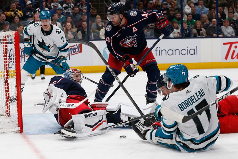 Mar 16, 2024; Columbus, Ohio, USA; Columbus Blue Jackets goalie Daniil Tarasov (40) makes a pad save on the shot from San Jose Sharks center Thomas Bordeleau (17) during the first period at Nationwide Arena. Mandatory Credit: Russell LaBounty-USA TODAY Sports