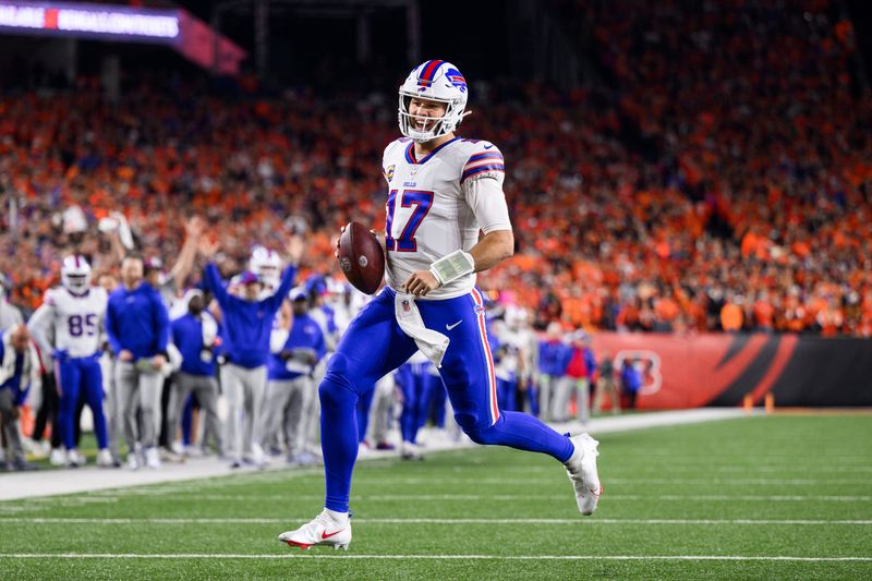 Buffalo Bills quarterback Josh Allen (17) scrambles down the field for a touchdown during an NFL football game against the Cincinnati Bengals, Sunday, Nov. 5, 2023, in Cincinnati. (AP Photo/Zach Bolinger)