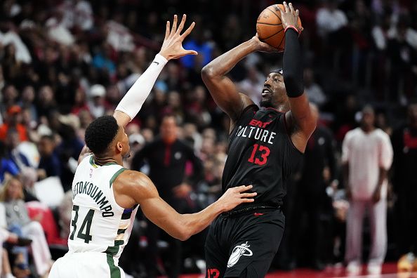 MIAMI, FLORIDA - NOVEMBER 28: Bam Adebayo #13 of the Miami Heat shoots the ball over Giannis Antetokounmpo #34 of the Milwaukee Bucks in the second quarter during the NBA In-season Tournament game at Kaseya Center on November 28, 2023 in Miami, Florida. NOTE TO USER: User Expressly acknowledges and agrees that, by downloading and or using this photograh, User is consenting to the terms and conditions of the Getty Images License Agreement. (Photo by Rich Storry/Getty Images)