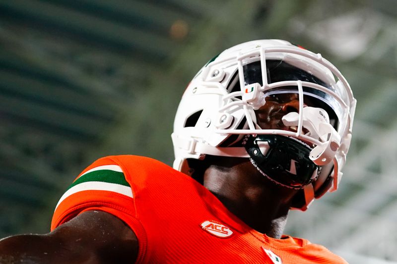 Oct 8, 2022; Miami Gardens, Florida, USA; Miami Hurricanes wide receiver Colbie Young (88) celebrates his  touch down against the North Carolina Tar Heels during the second half  at Hard Rock Stadium. Mandatory Credit: Rich Storry-USA TODAY Sports