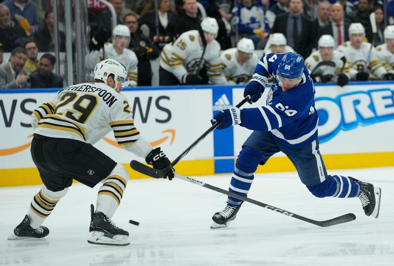 Apr 24, 2024; Toronto, Ontario, CAN; Toronto Maple Leafs forward David Kampf (64) shoots the puck as Boston Bruins defenseman Parker Wotherspoon (29) defends during the first period of game three of the first round of the 2024 Stanley Cup Playoffs at Scotiabank Arena. Mandatory Credit: John E. Sokolowski-USA TODAY Sports