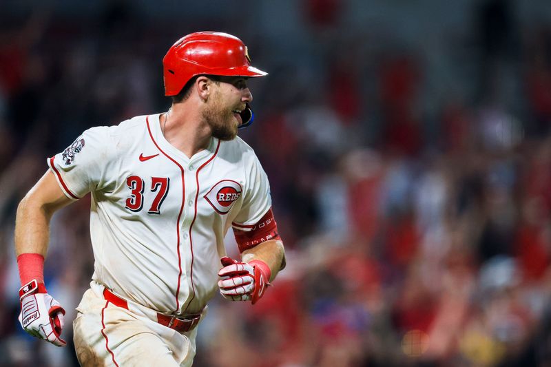 Sep 24, 2025; Cincinnati, Ohio, USA; Cincinnati Reds catcher Tyler Stephenson (37) reacts after hitting a solo home run in the ninth inning against the Pittsburgh Pirates at Great American Ball Park. Mandatory Credit: Katie Stratman-Imagn Images
