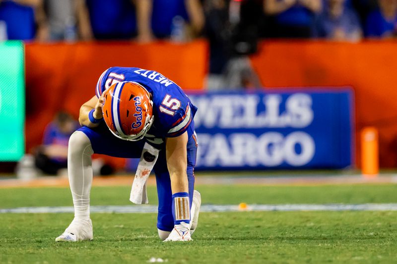 Sep 16, 2023; Gainesville, Florida, USA; Florida Gators quarterback Graham Mertz (15) takes a knee after a hit during the second half against the Tennessee Volunteers at Ben Hill Griffin Stadium. Mandatory Credit: Matt Pendleton-USA TODAY Sports