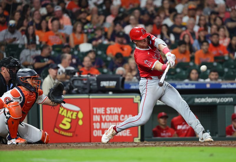 Sep 21, 2024; Houston, Texas, USA; Los Angeles Angels catcher Logan O'Hoppe (14) hits a double against the Houston Astros in the sixth inning at Minute Maid Park. Mandatory Credit: Thomas Shea-Imagn Images