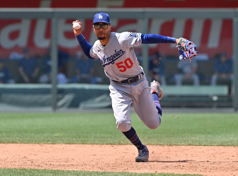 Jul 2, 2023; Kansas City, Missouri, USA;  Los Angeles Dodgers shortstop Mookie Betts (50) throws to first base in the sixth inning against the Kansas City Royals at Kauffman Stadium. Mandatory Credit: Peter Aiken-USA TODAY Sports