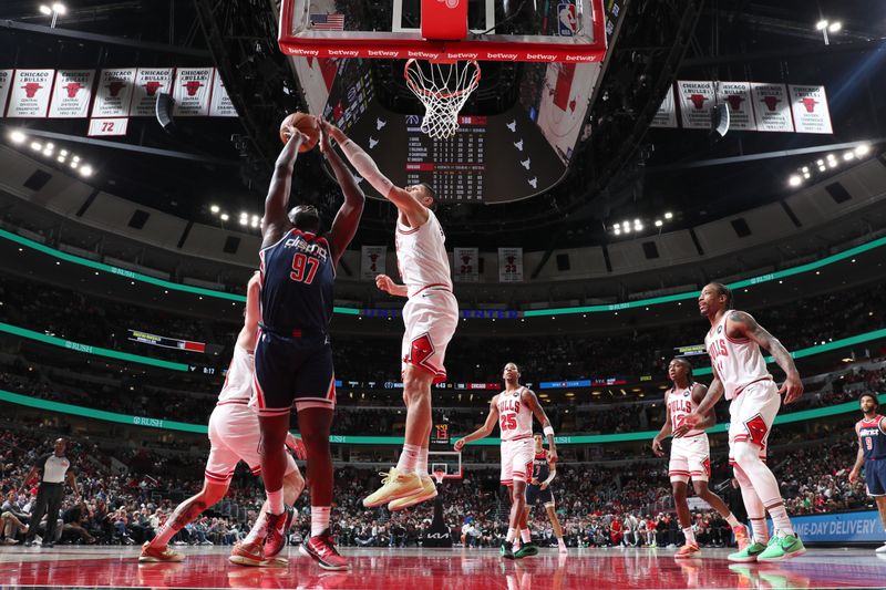 CHICAGO, IL - MARCH 16: Nikola Vucevic #9 of the Chicago Bulls blocks the ball during the game against the Washington Wizards on March 16, 2024 at United Center in Chicago, Illinois. NOTE TO USER: User expressly acknowledges and agrees that, by downloading and or using this photograph, User is consenting to the terms and conditions of the Getty Images License Agreement. Mandatory Copyright Notice: Copyright 2024 NBAE (Photo by Jeff Haynes/NBAE via Getty Images)