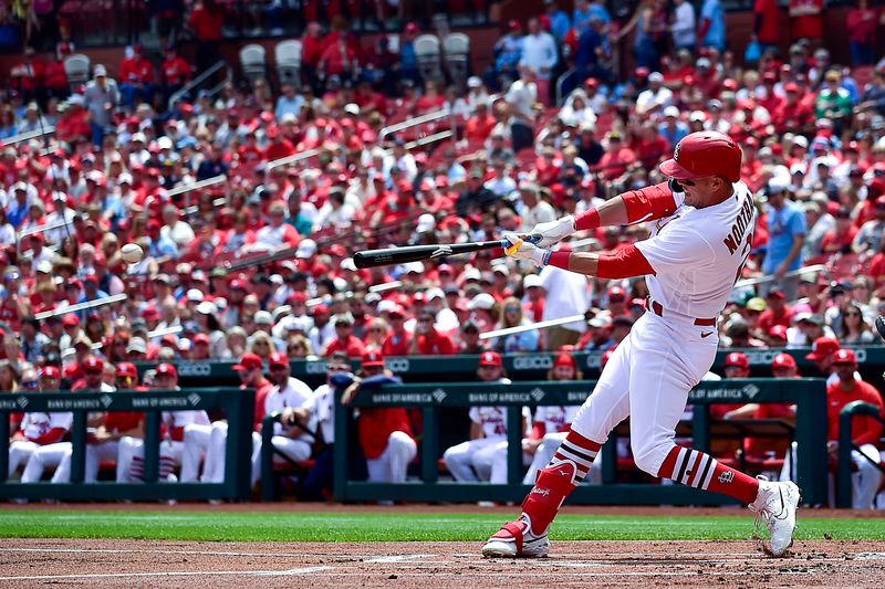 May 4, 2023; St. Louis, Missouri, USA;  St. Louis Cardinals right fielder Lars Nootbaar (21) hits a single against the Los Angeles Angels during the first inning at Busch Stadium. Mandatory Credit: Jeff Curry-USA TODAY Sports