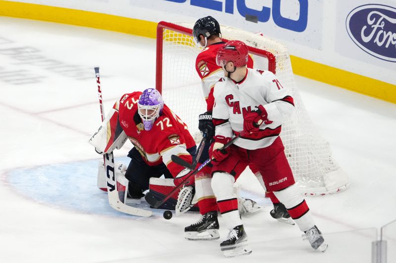 Nov 10, 2023; Sunrise, Florida, USA; Florida Panthers goaltender Sergei Bobrovsky (72) blocks the shot of Carolina Hurricanes right wing Jesper Fast (71) during the third period at Amerant Bank Arena. Mandatory Credit: Jasen Vinlove-USA TODAY Sports