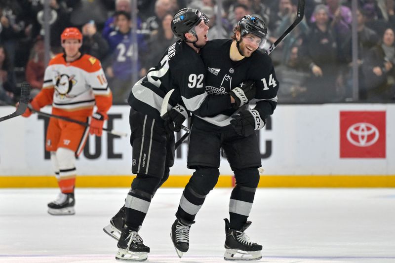 Dec 27, 2025; Los Angeles, California, USA;  Los Angeles Kings right wing Alex Laferriere (14) is congratulated by Los Angeles Kings defenseman Brandt Clarke (92) after scoring his first career hat trick in the third period against the Anaheim Ducks at Crypto.com Arena. Mandatory Credit: Jayne Kamin-Oncea-Imagn Images