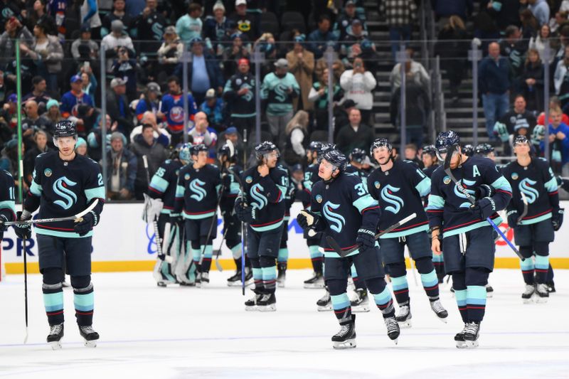 Nov 16, 2024; Seattle, Washington, USA; The Seattle Kraken celebrate after defeating the New York Islanders at Climate Pledge Arena. Mandatory Credit: Steven Bisig-Imagn Images